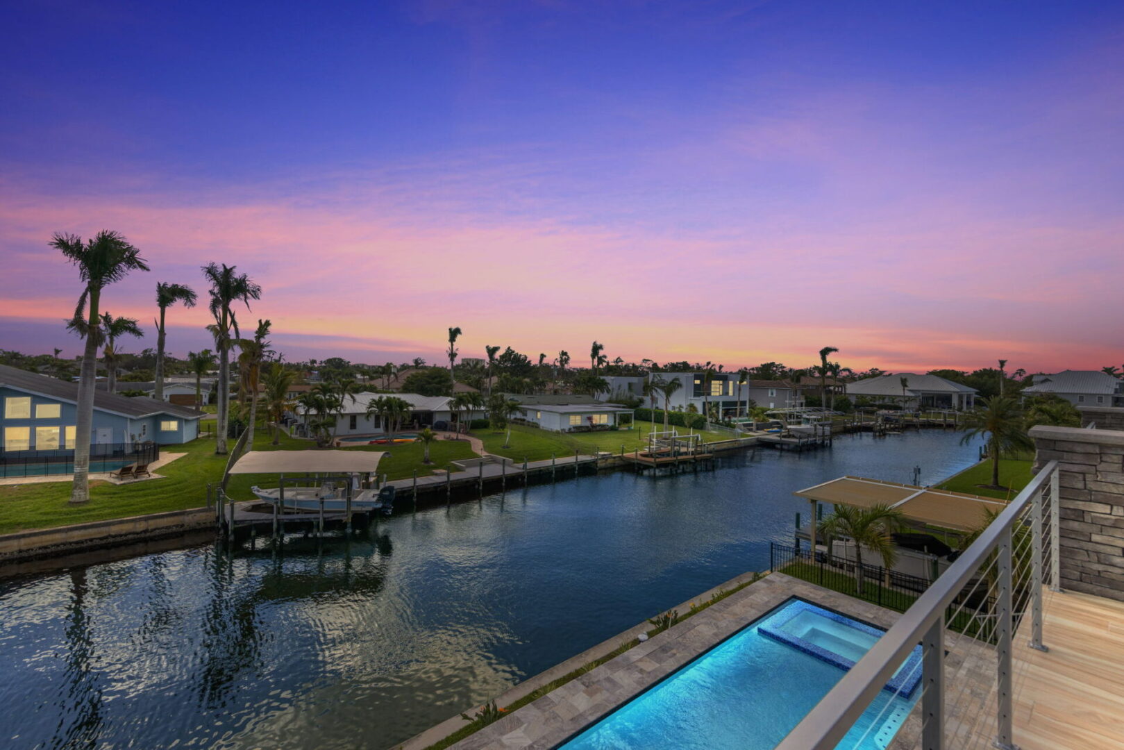 A pool and some houses on the water